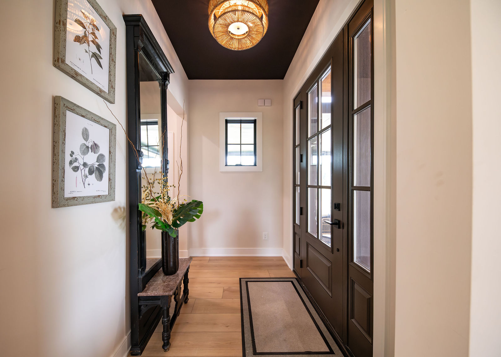 A welcoming staged foyer by Helpful Home Staging