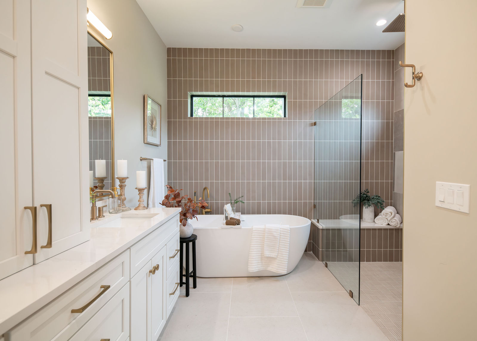 A serene staged spa bathroom by Helpful Home Staging